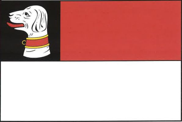 List tvoří černé karé a dva vodorovné pruhy, červený a bílý. V karé bílá hlava psa - věžníka s červeným, žlutě lemovaným obojkem s kroužkem. Poměr šířky k délce listu je 2 : 3.