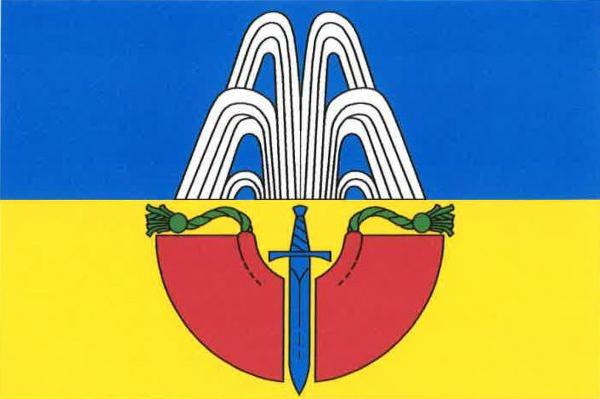 List tvoří dva vodorovné pruhy, modrý a žlutý. Ze středu horního okraje žlutého pruhu odkloněně tryská šest (3, 3) bílých pramenů. Ve žlutém pruhu modrý meč s hrotem na dolním okraji listu a s čepelí mezi dvěma půlemi rozprostřeného červeného pláště, naho