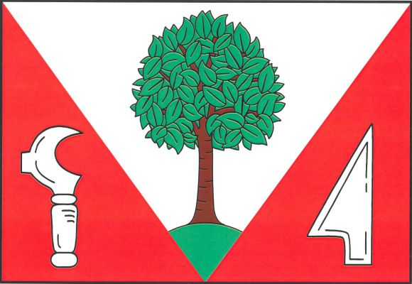 Červený list s bílým klínem vycházejícím z horního okraje listu a s vrcholem na jeho dolním okraji. V klínu na zeleném návrší zelený listnatý strom (ořešák) s hnědým kmenem.V dolním rohu vinařský nůž - kosíř hrotem nahoru a ostřím k vlajícímu okraji, v do